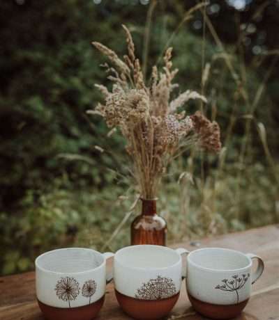 Two tone round earthenware mugs